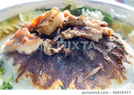 A preparation of roasted meat with sauce of 68926457