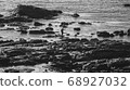 Man fishing for seafood with a stick in the Ons Islands, Galicia. Spain 68927032