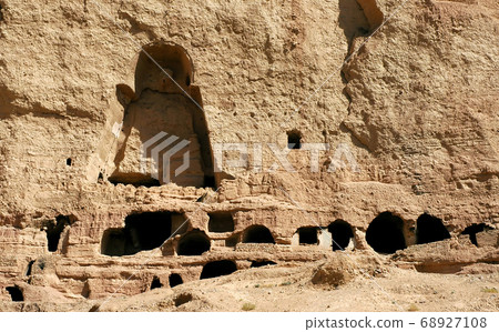 Caves in the cliffs near Bamyan (Bamiyan), Afghanistan. Local Afghan people still live in the caves. The caves are in cliffs where the Bamyan (Bamiyan) Buddhas used to stand. UNESCO site Afghanistan. Caves in the cliffs near Bamyan (Bamiyan), Afghanistan. Local Afghan people still live in the caves. The caves are in cliffs where the Bamyan (Bamiyan) Buddhas used to stand. UNESCO site Afghanistan. 68927108