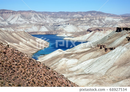 Band-e Amir lakes near Bamyan (Bamiyan) in Central Afghanistan. Band e Amir was the first national park in Afghanistan. This is the panorama from a viewpoint on the road to Band e Amir, Afghanistan. Band-e Amir lakes near Bamyan (Bamiyan) in Central Afghanistan. Band e Amir was the first national park in Afghanistan. This is the panorama from a viewpoint on the road to Band e Amir, Afghanistan. 68927534