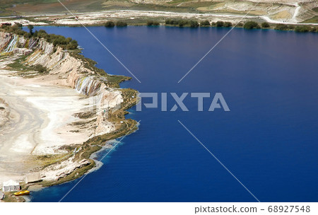 Band-e Amir lakes near Bamyan (Bamiyan) in Central Afghanistan. The blue lakes at Band e Amir national park are formed by travertine dams. View of a travertine wall at Band e Amir, Afghanistan. Band-e Amir lakes near Bamyan (Bamiyan) in Central Afghanistan. The blue lakes at Band e Amir national park are formed by travertine dams. View of a travertine wall at Band e Amir, Afghanistan. 68927548