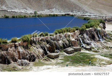 Band-e Amir lakes near Bamyan (Bamiyan) in Central Afghanistan. Band e Amir was the first national park in Afghanistan. The natural blue lakes are formed by travertine dams. View of a travertine wall. Band-e Amir lakes near Bamyan (Bamiyan) in Central Afghanistan. Band e Amir was the first national park in Afghanistan. The natural blue lakes are formed by travertine dams. View of a travertine wall. 68927557