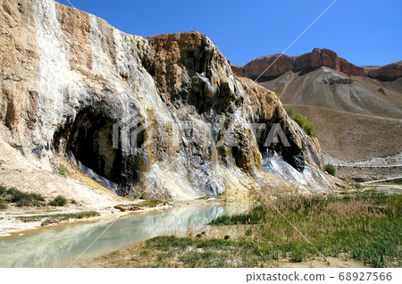Band-e Amir lakes near Bamyan (Bamiyan) in Central Afghanistan. The lakes at Band e Amir national park are formed by travertine dams. Detail of a travertine wall from below at Band e Amir, Afghanistan Band-e Amir lakes near Bamyan (Bamiyan) in Central Afghanistan. The lakes at Band e Amir national park are formed by travertine dams. Detail of a travertine wall from below at Band e Amir, Afghanistan 68927566