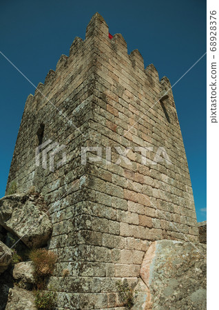 Square tower made of stone in a castle 68928376
