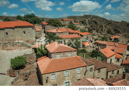 Gothic houses and chapel with deserted square 68928555