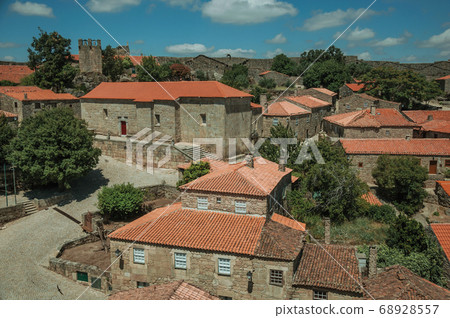 Gothic houses and chapel with deserted square 68928557