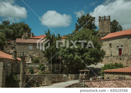 Stone houses and chapel encircling a square Stone houses and chapel encircling a square 68928566