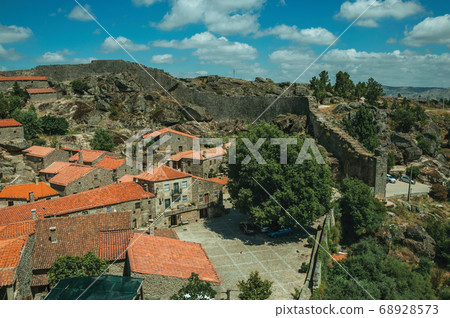Rooftops of stone houses with square and large wall Rooftops of stone houses with square and large wall 68928573