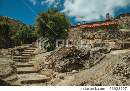 Gothic houses made of stone with stairway on slope 68928597