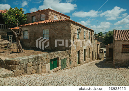 Houses made of stone with staircase in an alley Houses made of stone with staircase in an alley 68928633