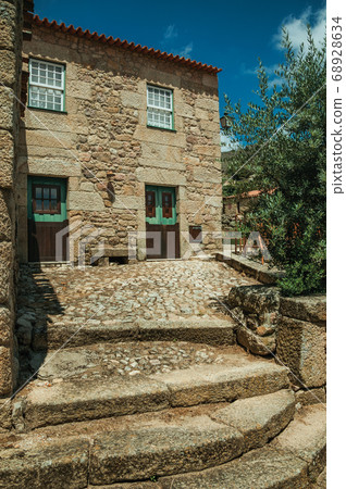 House made of stone with large steps 68928634