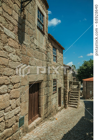 Old house with wooden door and staircase on alley Old house with wooden door and staircase on alley 68928640