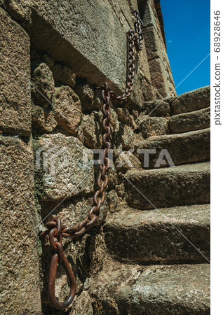 Gothic house with stone staircase and iron chain 68928646