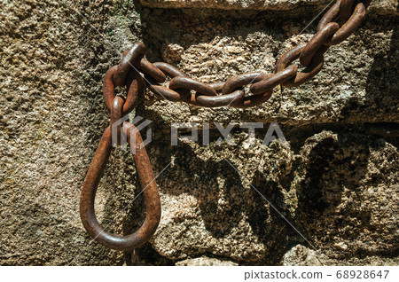 House made of stone with wooden door 68928647