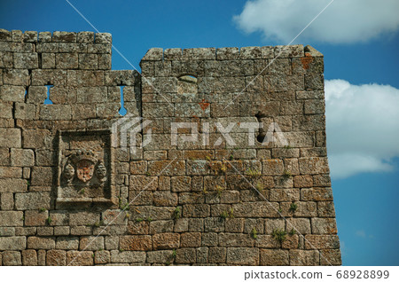 Family coat of arms carved on a wall made of stone Family coat of arms carved on a wall made of stone 68928899
