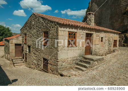 Gothic house and stone staircase in deserted alley 68928900