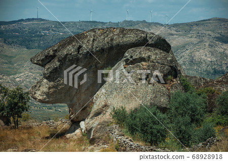 Rock that looks like the head profile of an old woman 68928918