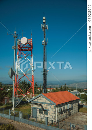 Telecommunication towers on a base transceiver station Telecommunication towers on a base transceiver station 68928942