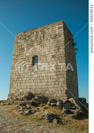 Stone square tower over rocky hill at Guarda 68929014