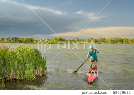 solo senior male stand up paddler solo senior male stand up paddler 68929622