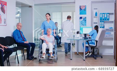 Doctor giving nurse radiography Doctor giving nurse radiography 68939727