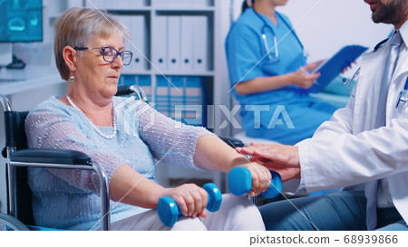 Physiotherapy for elderly woman in wheelchair Physiotherapy for elderly woman in wheelchair 68939866