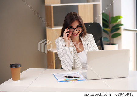 Adult young pretty business woman working in coworking. She is very busy 68940912