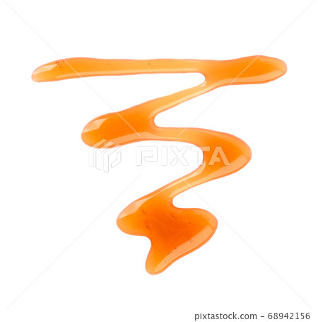 Maple syrup drizzle isolated on white background. Splashes of sweet maple syrup. Top view. 68942156