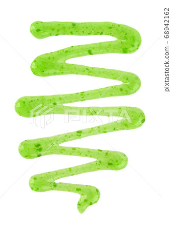 Kiwi jam drizzle isolated on white background. Splashes of green jam. Top view. Kiwi jam drizzle isolated on white background. Splashes of green jam. Top view. 68942162
