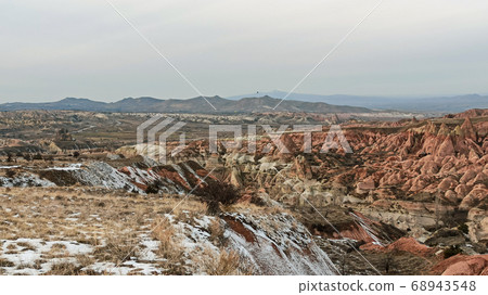Red Valley in Cappadocia, Turkey. Unique volcanic landscape and geologic rock formations in Cappadocia. Red Valley in Cappadocia, Turkey. Unique volcanic landscape and geologic rock formations in Cappadocia. 68943548