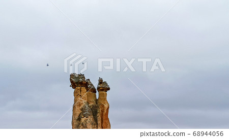 Fairy Chimneys at Pasabag, the valley of the monks in Goreme. Rock Formations with multihead stone mushroom fairy chimneys in Pasabag, Cappadocia, Turkey 68944056