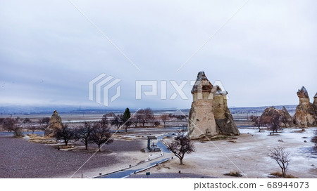 Fairy Chimneys at Pasabag, the valley of the monks in Goreme. Rock Formations with multihead stone mushroom fairy chimneys in Pasabag, Cappadocia, Turkey 68944073