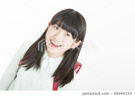 Smiley female elementary school student 68944133