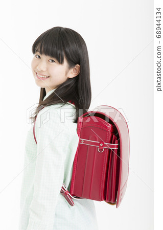 Smiley female elementary school student 68944134