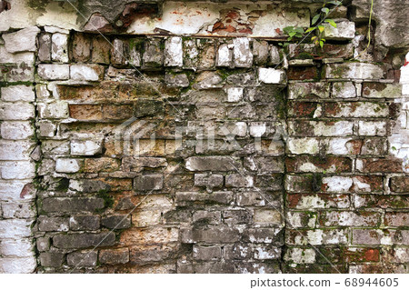 Old destroyed wall with crumbling bricks Old destroyed wall with crumbling bricks 68944605