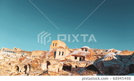 Cave houses and monasteries carved into Tufa Rocks at Zelve Open Air Museum (Zelve Valley) in winter season in Cappadocia, Turkey Cave houses and monasteries carved into Tufa Rocks at Zelve Open Air Museum (Zelve Valley) in winter season in Cappadocia, Turkey 68945498