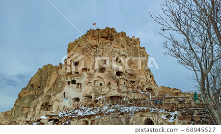 Cave houses and monasteries carved into Tufa Rocks at Zelve Open Air Museum (Zelve Valley) in winter season in Cappadocia, Turkey Cave houses and monasteries carved into Tufa Rocks at Zelve Open Air Museum (Zelve Valley) in winter season in Cappadocia, Turkey 68945527