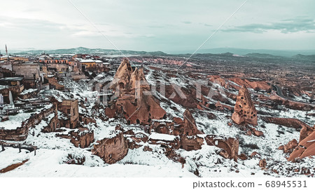 Cave houses and monasteries carved into Tufa Rocks at Zelve Open Air Museum (Zelve Valley) in winter season in Cappadocia, Turkey Cave houses and monasteries carved into Tufa Rocks at Zelve Open Air Museum (Zelve Valley) in winter season in Cappadocia, Turkey 68945531