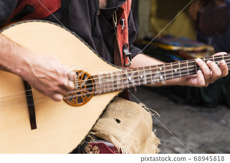 street musician playing street musician playing 68945818