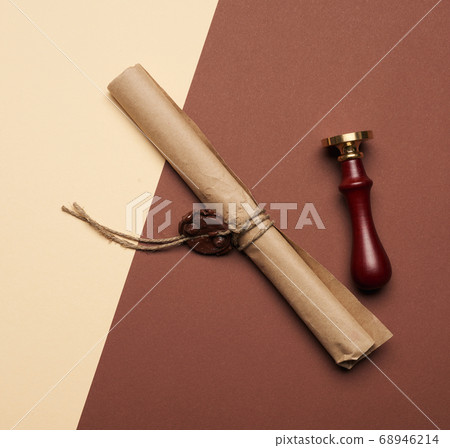brown paper roll sealed with wax seal, top view 68946214