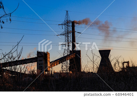 View of old factory with pipes with smoke 68946401