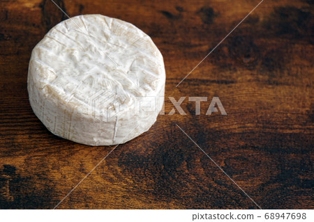 Camembert cheese on a wooden table Camembert cheese on a wooden table 68947698