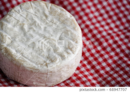 Camembert cheese on red table napkin 68947707