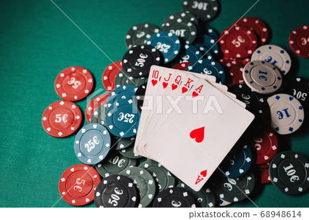 layout of cards with the Royal flush on the chips layout of cards with the Royal flush on the chips 68948614