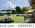Amusement park landscape with flying soap bubbles 68949361