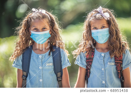 The twin sisters with face masks go back to school The twin sisters with face masks go back to school 68951438