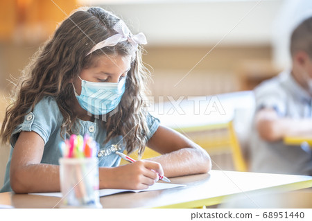 Cute little pupil girl with face mask back at Cute little pupil girl with face mask back at 68951440