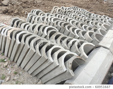SEREMBAN, MALAYSIA -AUGUST 28, MALAYSIA: U shape precast drain at the construction site. Built of reinforced concrete. These materials are collected and stacked on top of each other before installing. 68951687