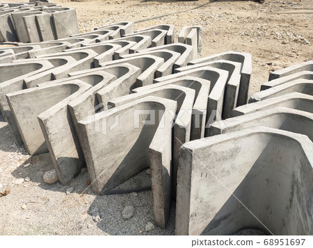 SEREMBAN, MALAYSIA -AUGUST 28, MALAYSIA: U shape precast drain at the construction site. Built of reinforced concrete. These materials are collected and stacked on top of each other before installing. 68951697