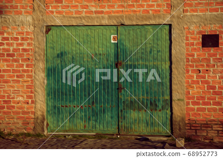 Old and rusty metallic gateway in a brick building 68952773
